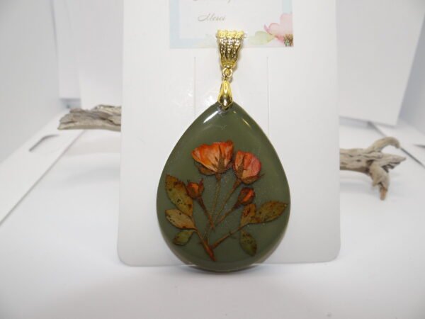 Pendentif ovale vert avec fleurs orange