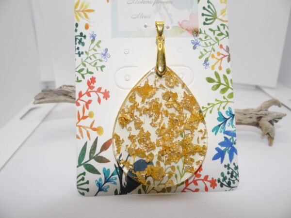 Pendentif ovale transparent avec fleurs jaune