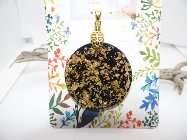 Pendentif rond noir et doré